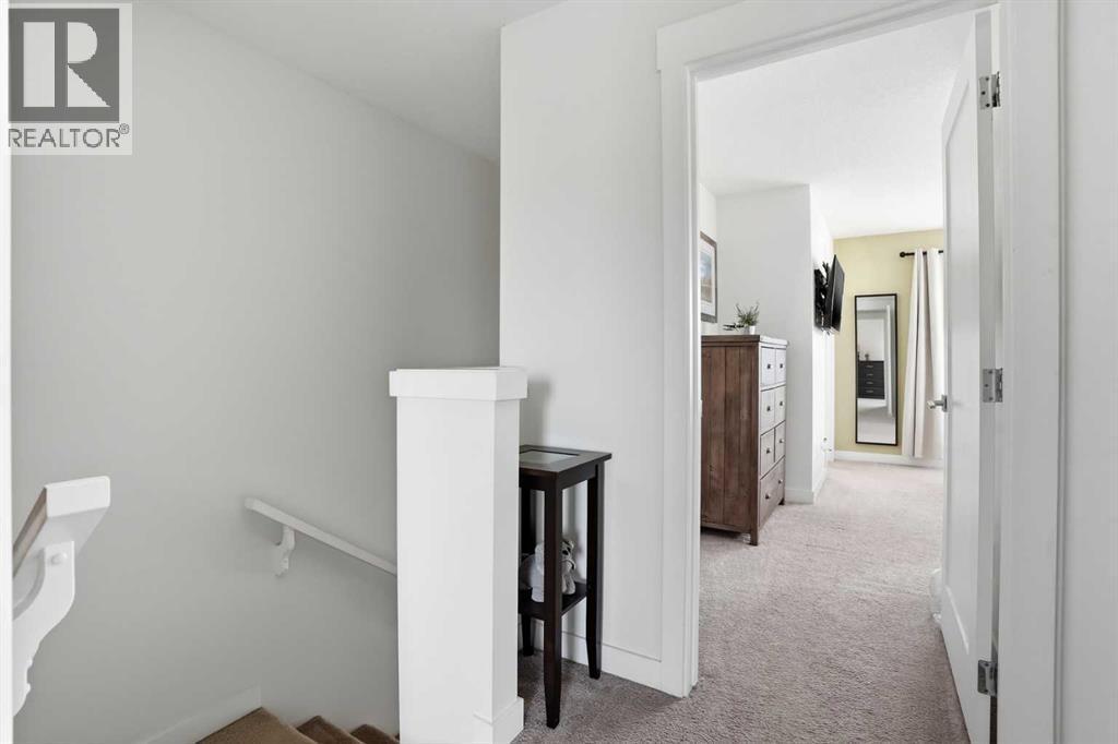 Upstairs landing - 70, 111 Rainbow Falls Gate, Chestermere, AB - Indoor Photo Showing Other Room