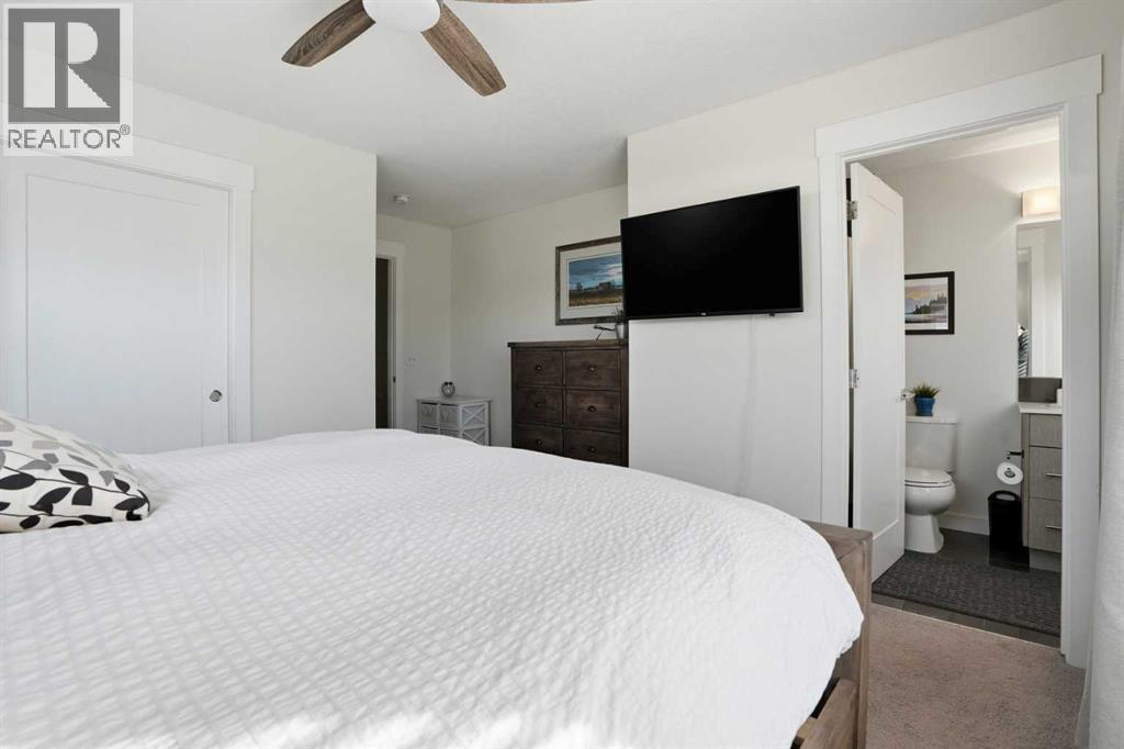Primary suite - 70, 111 Rainbow Falls Gate, Chestermere, AB - Indoor Photo Showing Bedroom