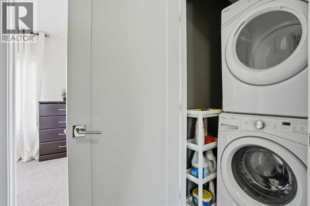 In-unit laundry - 70, 111 Rainbow Falls Gate, Chestermere, AB - Indoor Photo Showing Laundry Room
