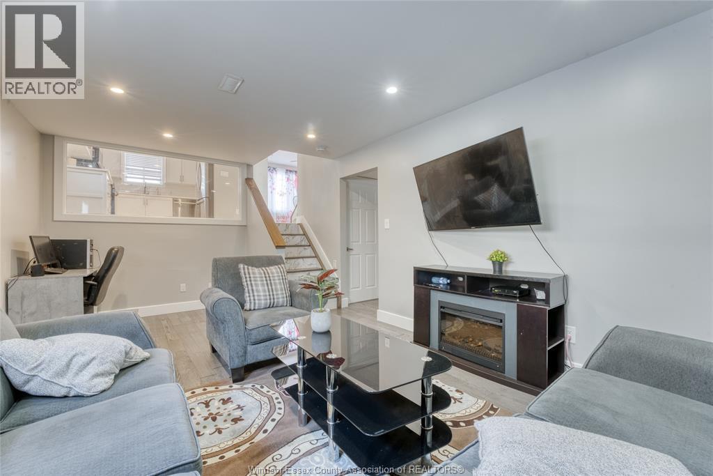 2901 Robillard Cresent, Windsor, ON - Indoor Photo Showing Living Room With Fireplace