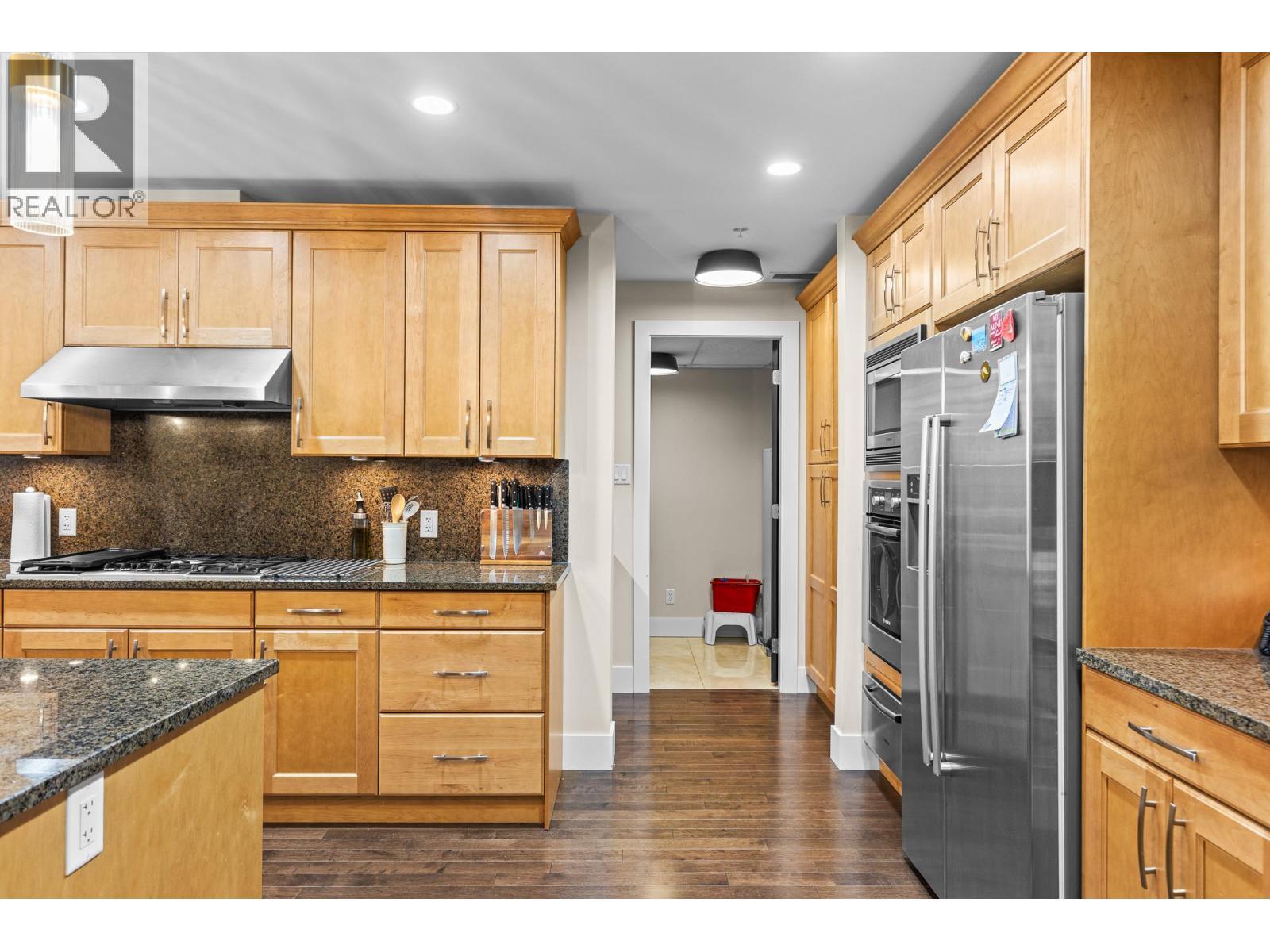 Entrance to Laundry Room - 1395 Ellis Street Unit# 506, Kelowna, BC - Indoor Photo Showing Kitchen With Upgraded Kitchen
