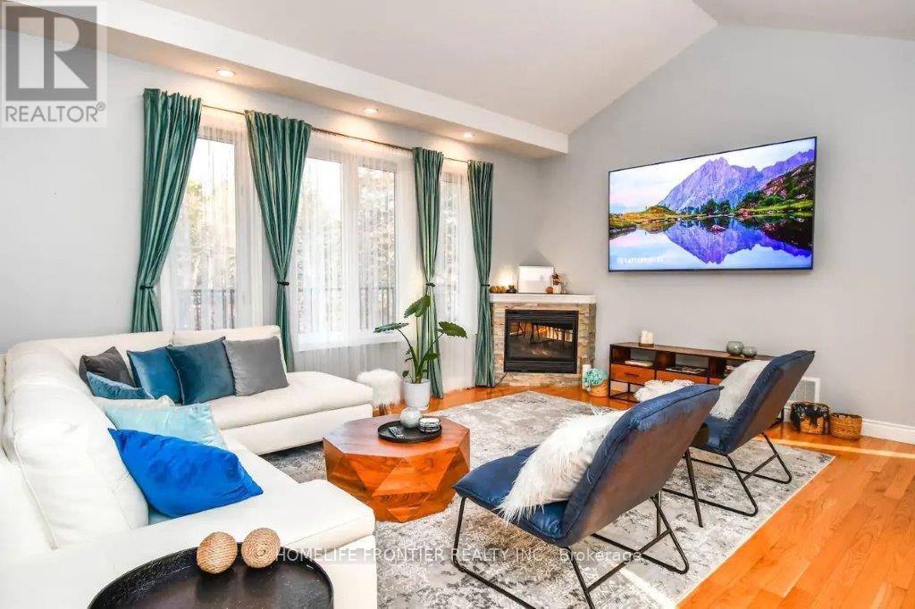 42 Forest Circle, Tiny, ON - Indoor Photo Showing Living Room With Fireplace