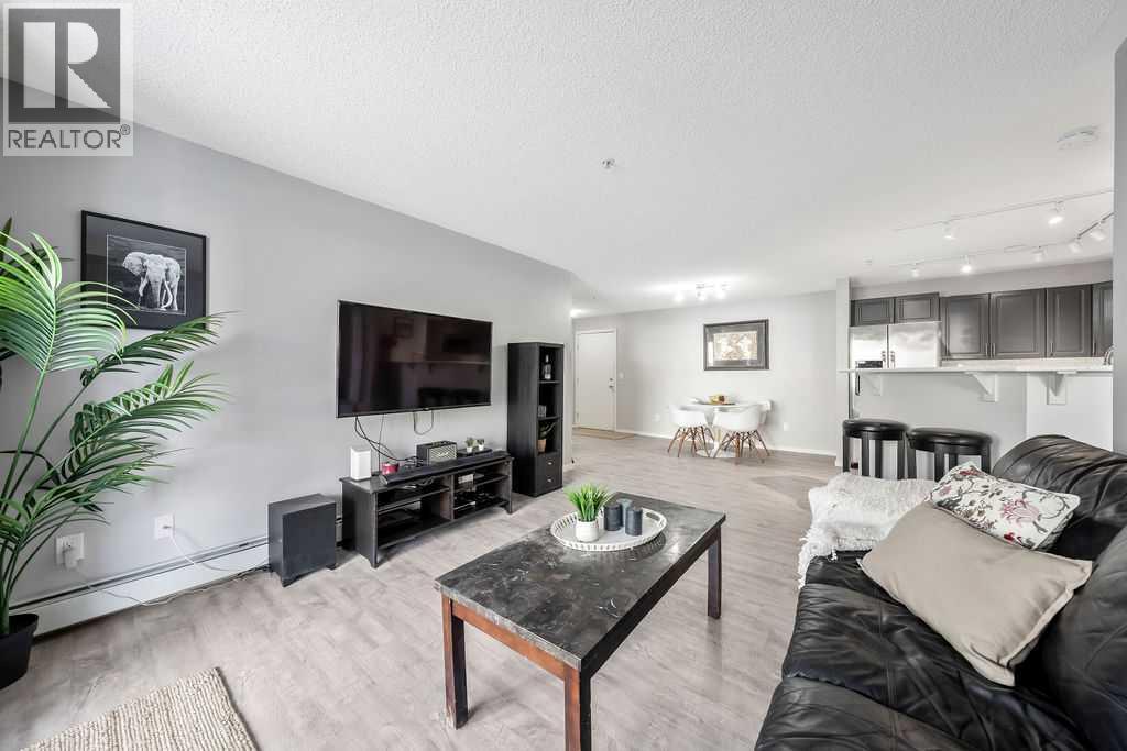 1120, 4975 130 Avenue Se, Calgary, AB - Indoor Photo Showing Living Room