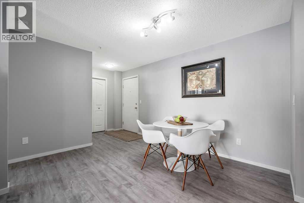 Dining Area and Entryway - 1120, 4975 130 Avenue Se, Calgary, AB - Indoor Photo Showing Dining Room