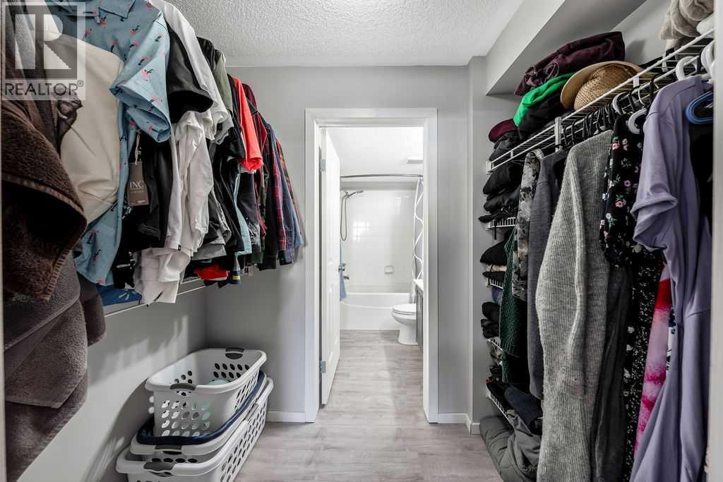 Primary Walk-through Closet - 1120, 4975 130 Avenue Se, Calgary, AB - Indoor With Storage