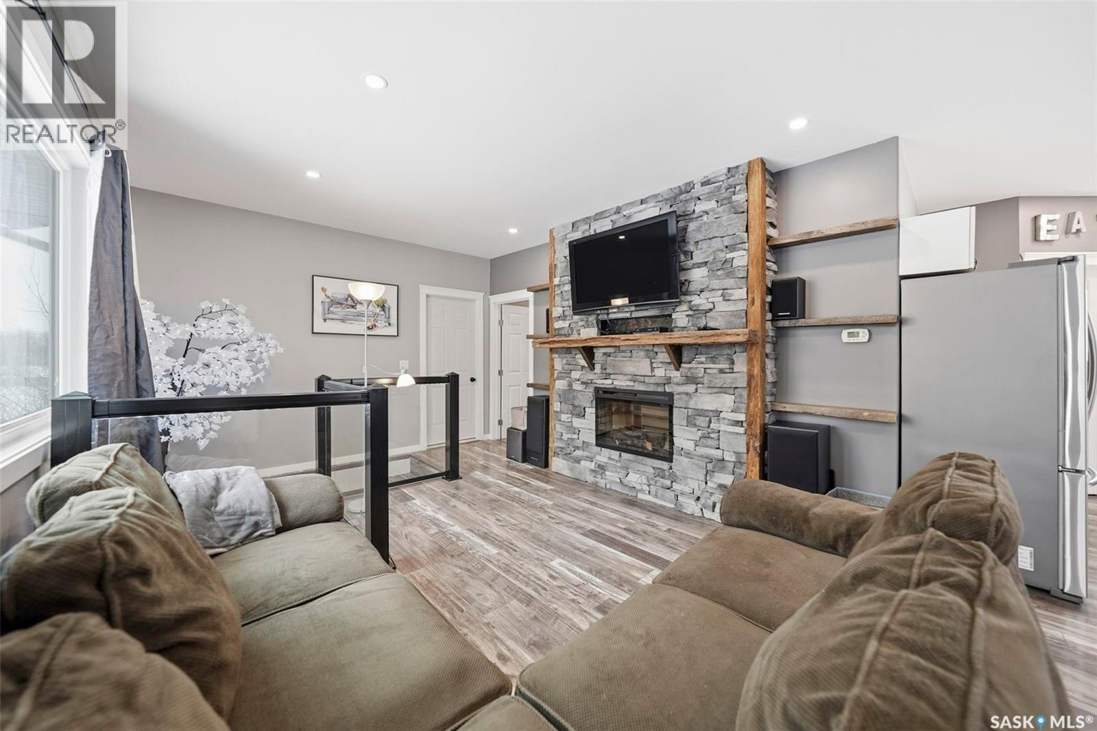 1110 Main Street N, Watrous, SK - Indoor Photo Showing Living Room With Fireplace