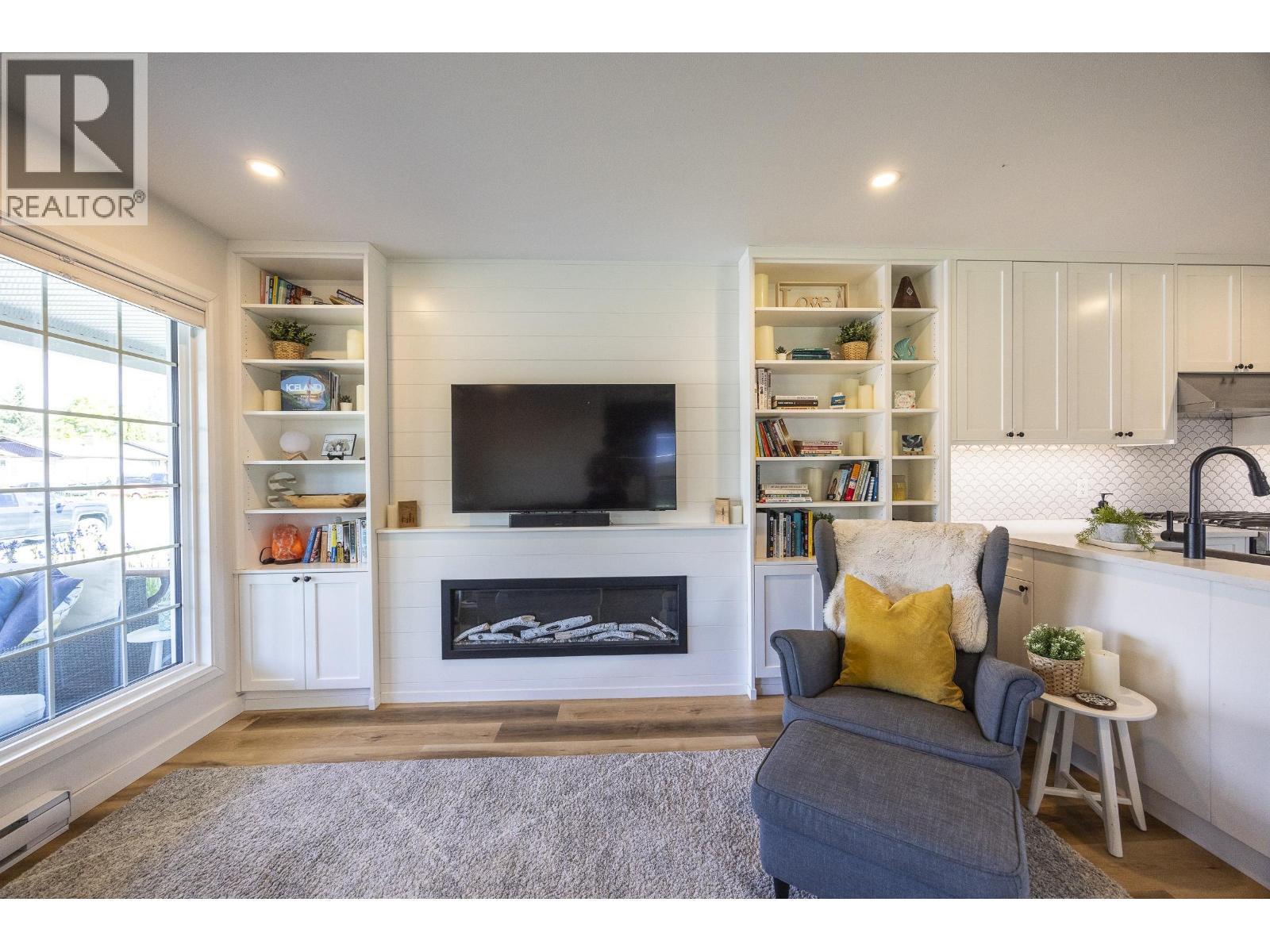 1 2218 Evergreen Street, Terrace, BC - Indoor Photo Showing Living Room With Fireplace