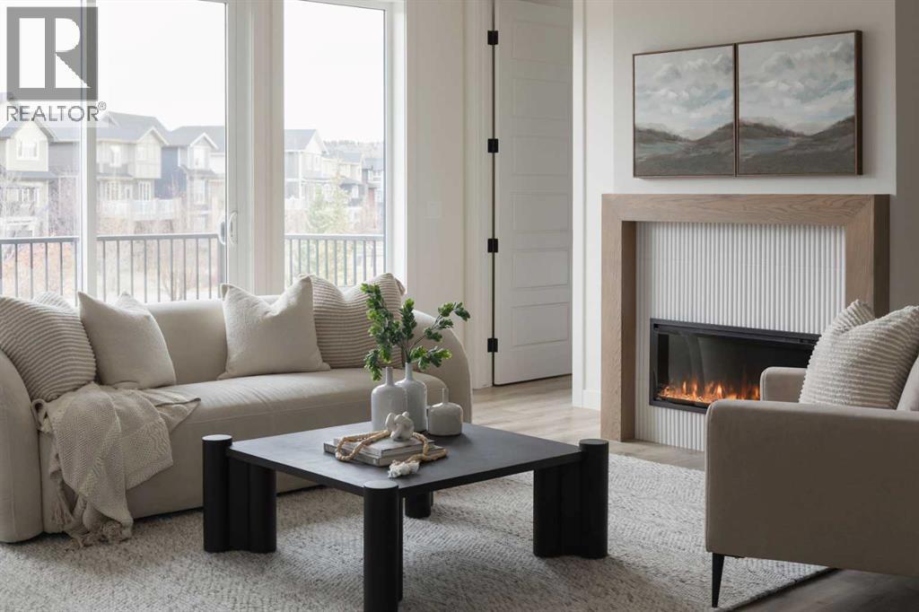 88 Sunrise Heath, Cochrane, AB - Indoor Photo Showing Living Room With Fireplace