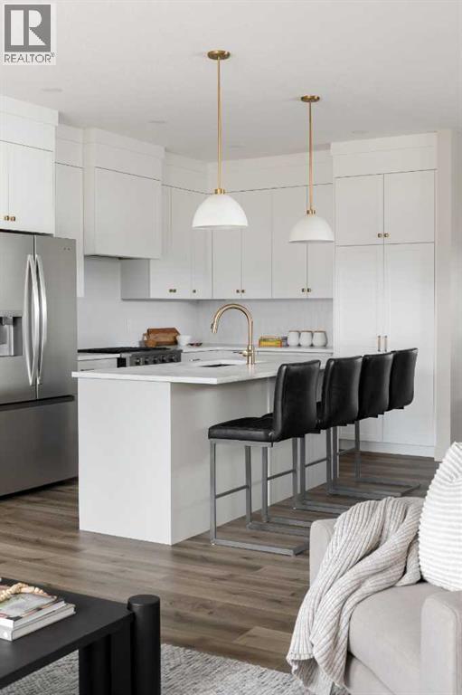 88 Sunrise Heath, Cochrane, AB - Indoor Photo Showing Kitchen With Upgraded Kitchen