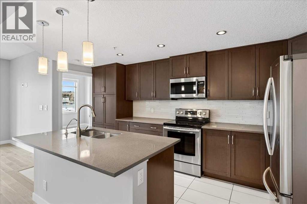 501, 24 Varsity Estates Circle Nw, Calgary, AB - Indoor Photo Showing Kitchen With Double Sink With Upgraded Kitchen
