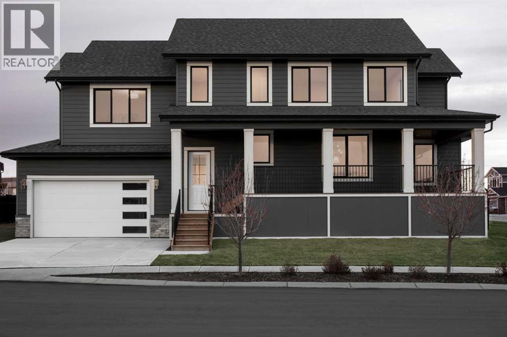 28 Sunvalley View, Cochrane, AB - Outdoor With Facade