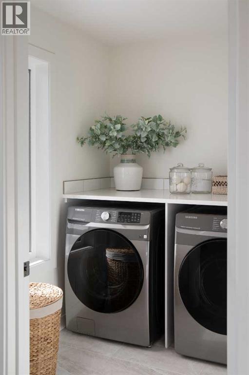 28 Sunvalley View, Cochrane, AB - Indoor Photo Showing Laundry Room