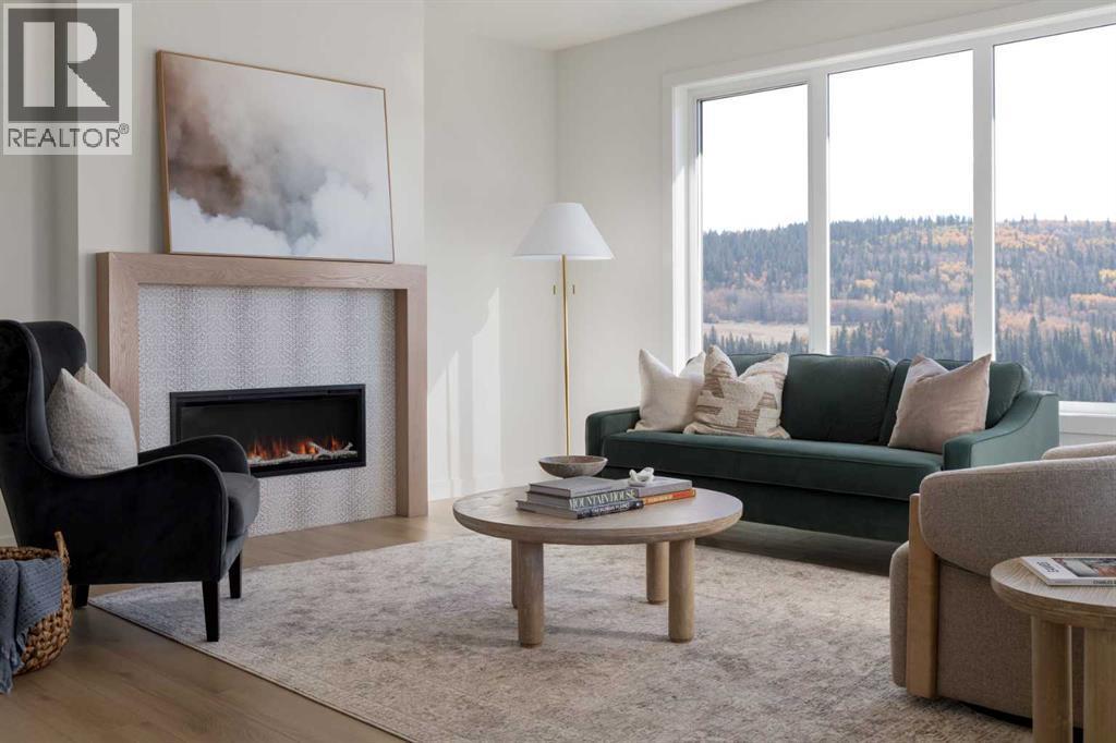 28 Sunvalley View, Cochrane, AB - Indoor Photo Showing Living Room With Fireplace