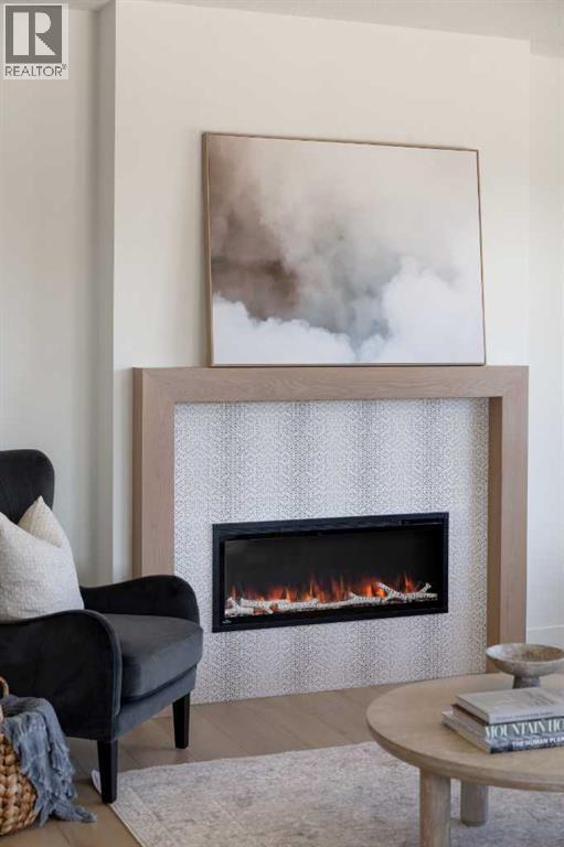 28 Sunvalley View, Cochrane, AB - Indoor Photo Showing Living Room With Fireplace