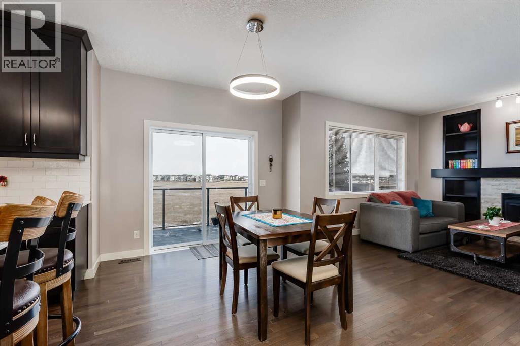 Amazing view of the Environmental Reserve - 382 Williamstown Green Nw, Airdrie, AB - Indoor With Fireplace