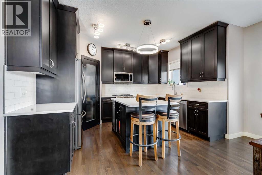 RecentlyUpgraded Countertop & Backsplash - 382 Williamstown Green Nw, Airdrie, AB - Indoor Photo Showing Kitchen With Upgraded Kitchen