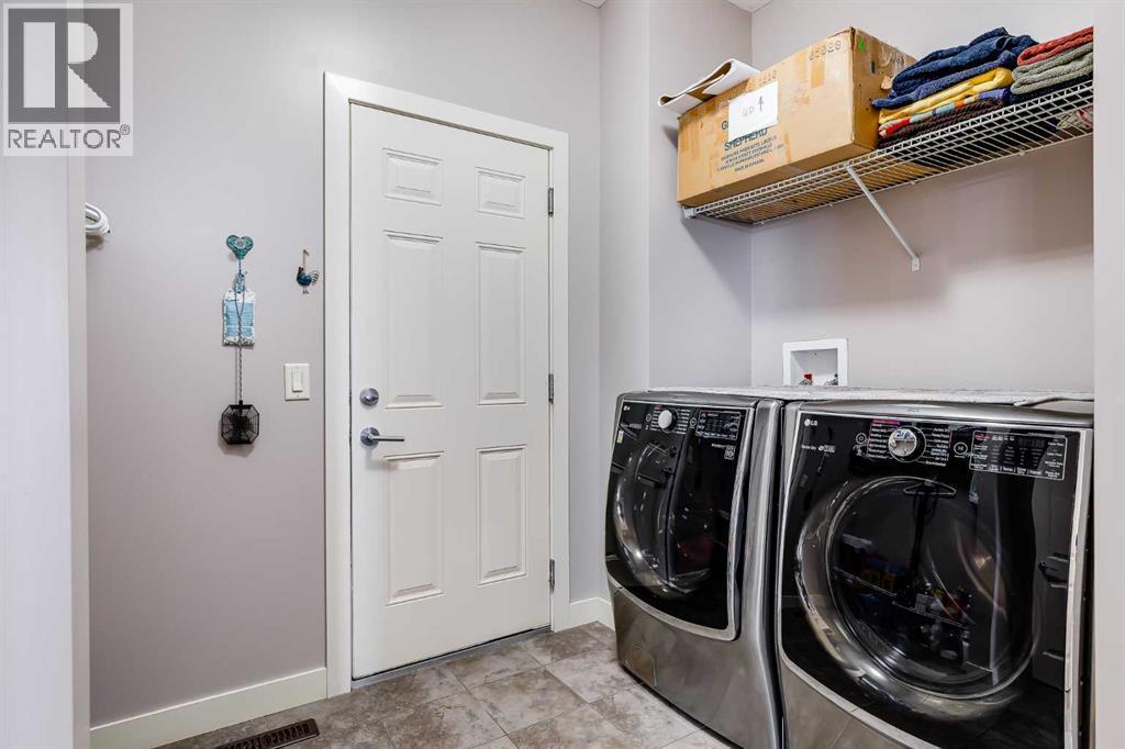 Main Level Laundry - 382 Williamstown Green Nw, Airdrie, AB - Indoor Photo Showing Laundry Room