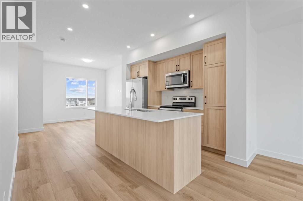 1506, 25 Wildwoods Court Sw, Airdrie, AB - Indoor Photo Showing Kitchen With Upgraded Kitchen