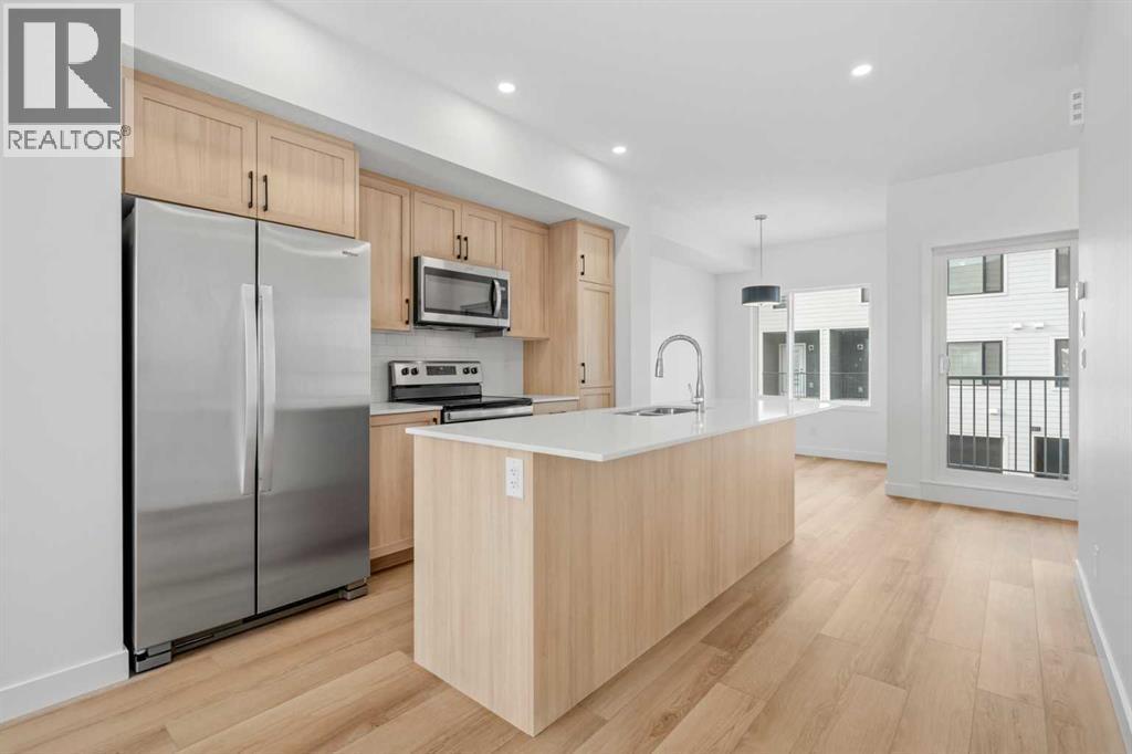 1506, 25 Wildwoods Court Sw, Airdrie, AB - Indoor Photo Showing Kitchen With Stainless Steel Kitchen With Upgraded Kitchen