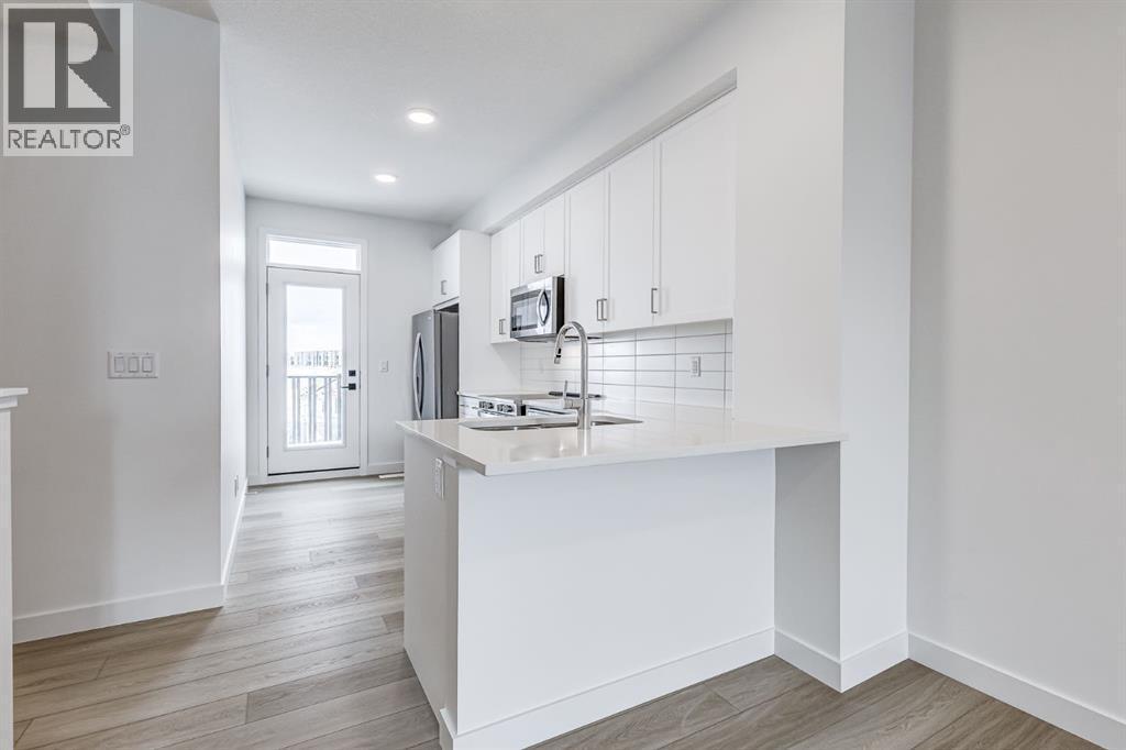 202, 437 Alpine Avenue Sw, Calgary, AB - Indoor Photo Showing Kitchen