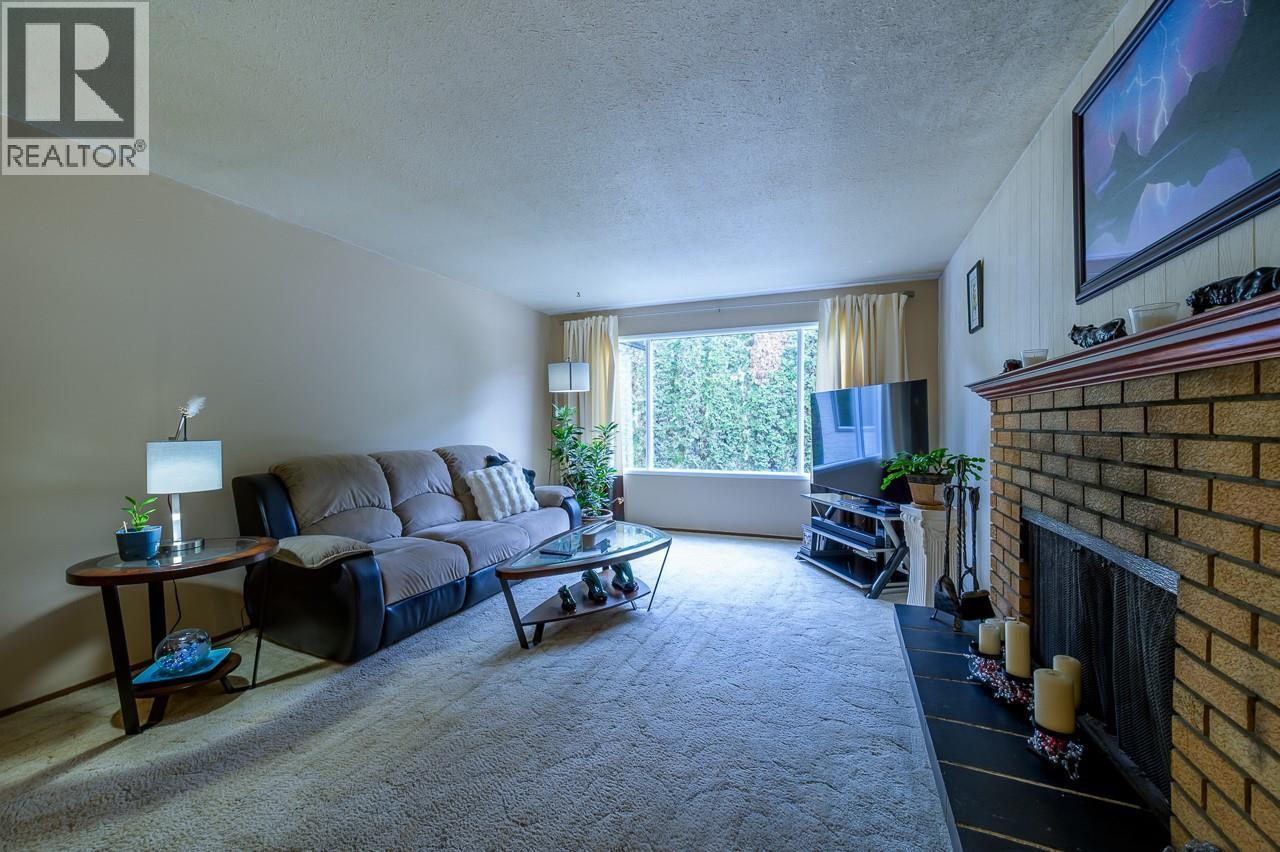 1835 Westsyde Road, Kamloops, BC - Indoor Photo Showing Living Room With Fireplace