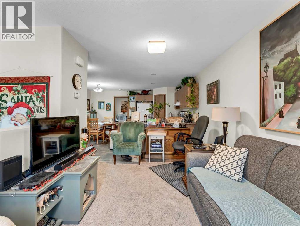 628 Industrial Avenue Se, Medicine Hat, AB - Indoor Photo Showing Living Room With Fireplace