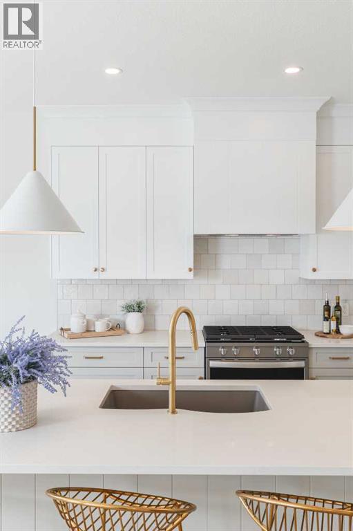 47 Sundown Crescent, Cochrane, AB - Indoor Photo Showing Kitchen With Double Sink With Upgraded Kitchen