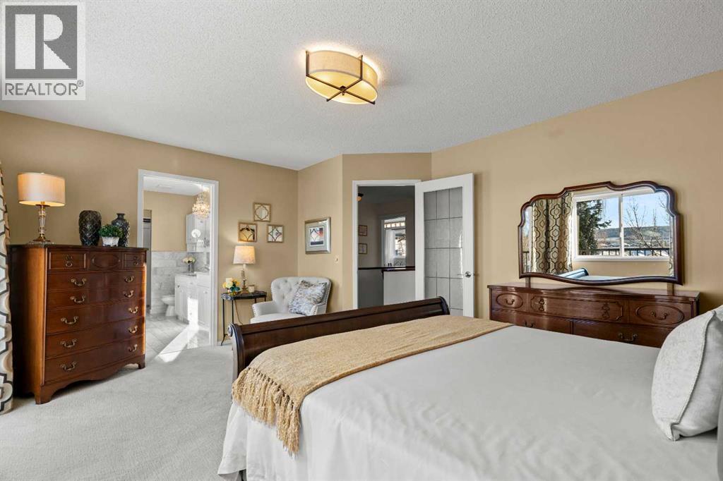 63 Springbank Crescent Sw, Calgary, AB - Indoor Photo Showing Bedroom