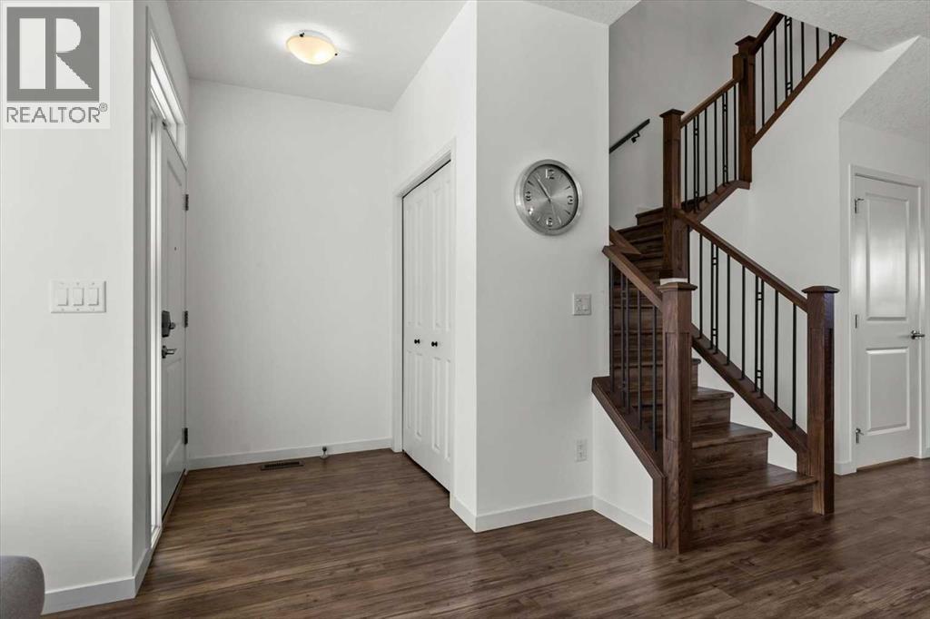 A spacious foyer welcomes you to this lovely family home - 59 Wolf Hollow Way Se, Calgary, AB - Indoor Photo Showing Other Room