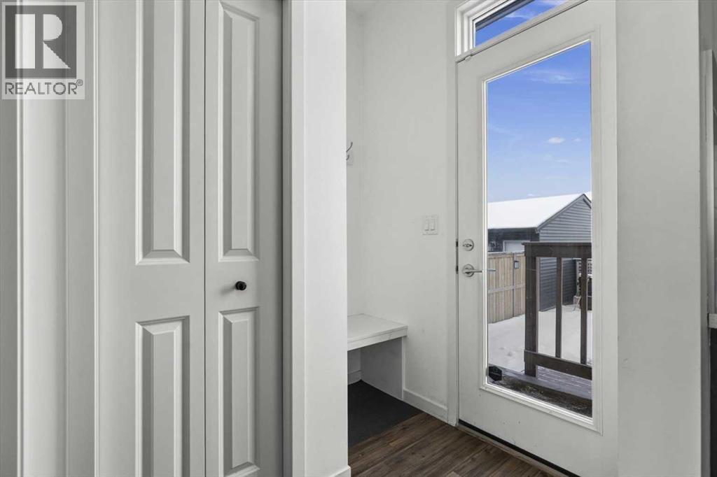 The mudroom and back door lead you to the amazing outdoors, which is an extension of the living space - 59 Wolf Hollow Way Se, Calgary, AB - Indoor Photo Showing Other Room