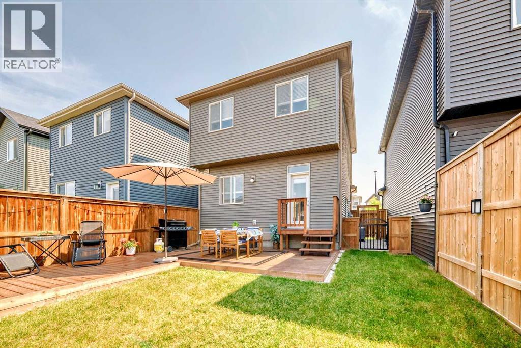 The expansive deck offers multiple seating zones, perfect for relaxing or entertaining - 59 Wolf Hollow Way Se, Calgary, AB - Outdoor With Deck Patio Veranda With Exterior