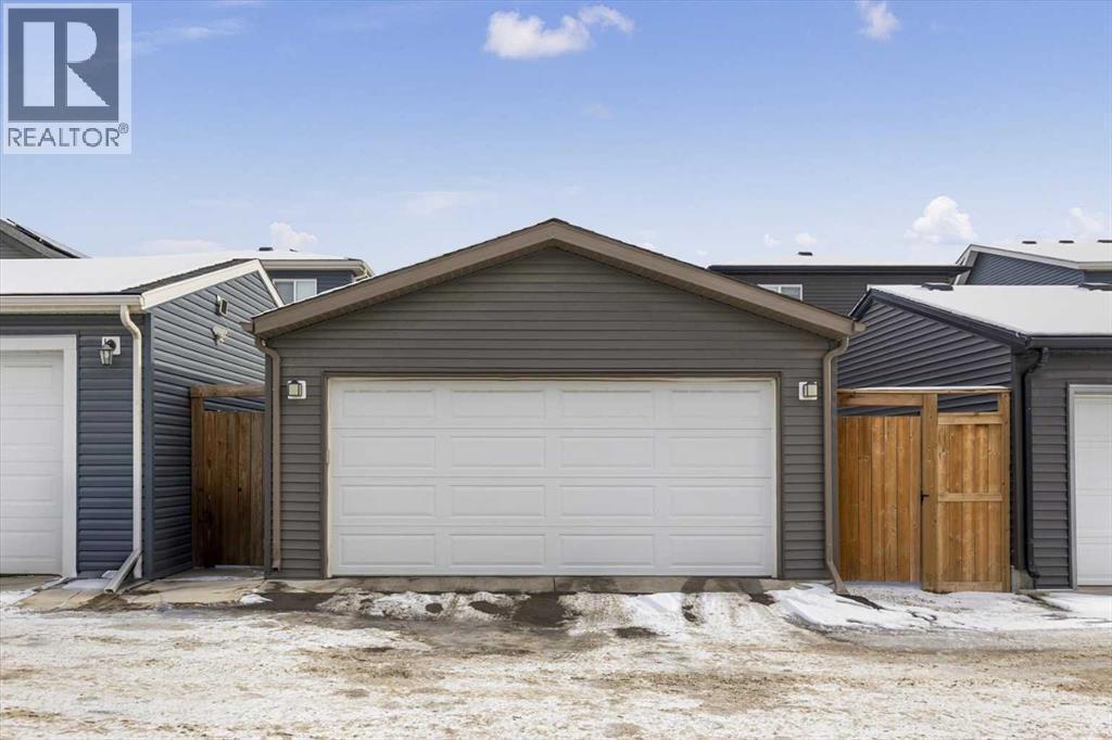Oversized double car garage - access from the back lane - 59 Wolf Hollow Way Se, Calgary, AB - Outdoor With Exterior