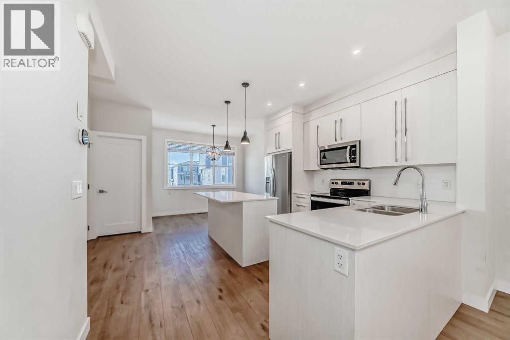 Kitchen - 301, 50 Cornerstone Passage, Calgary, AB - Indoor Photo Showing Kitchen With Double Sink With Upgraded Kitchen