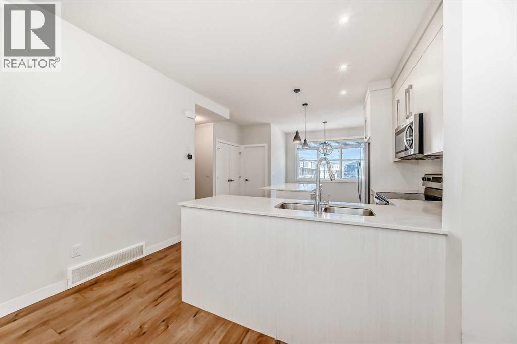 301, 50 Cornerstone Passage, Calgary, AB - Indoor Photo Showing Kitchen With Double Sink