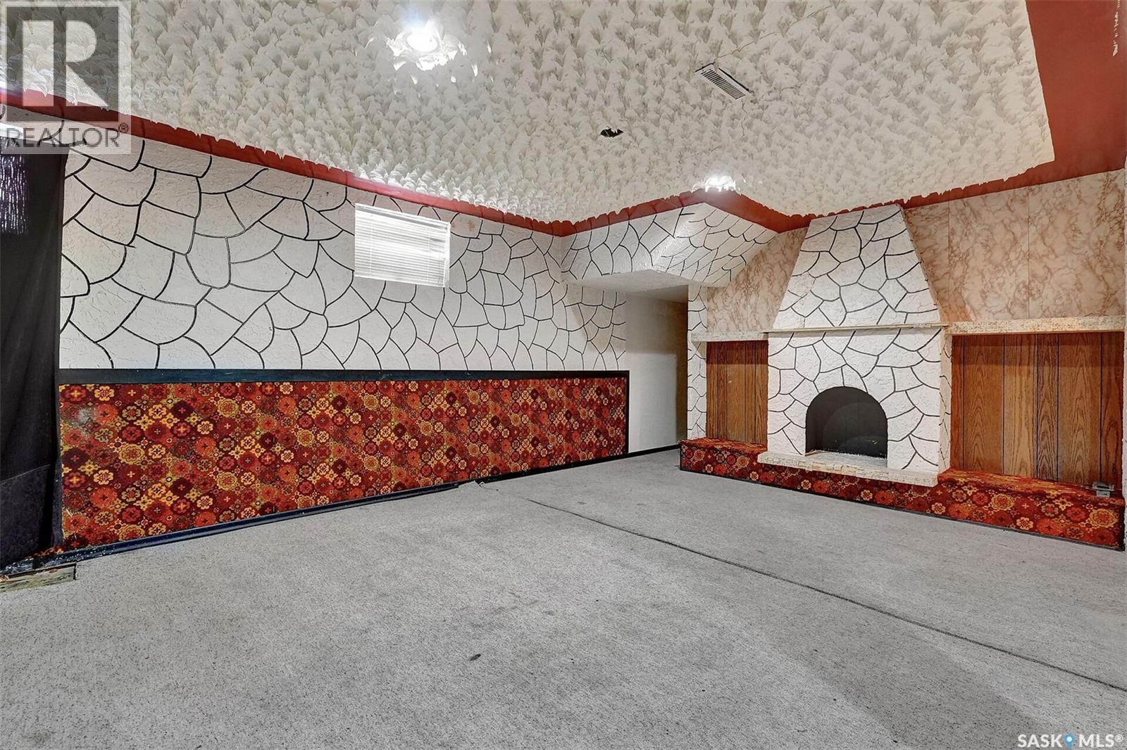219 Mccarthy Boulevard N, Regina, SK - Indoor Photo Showing Other Room With Fireplace