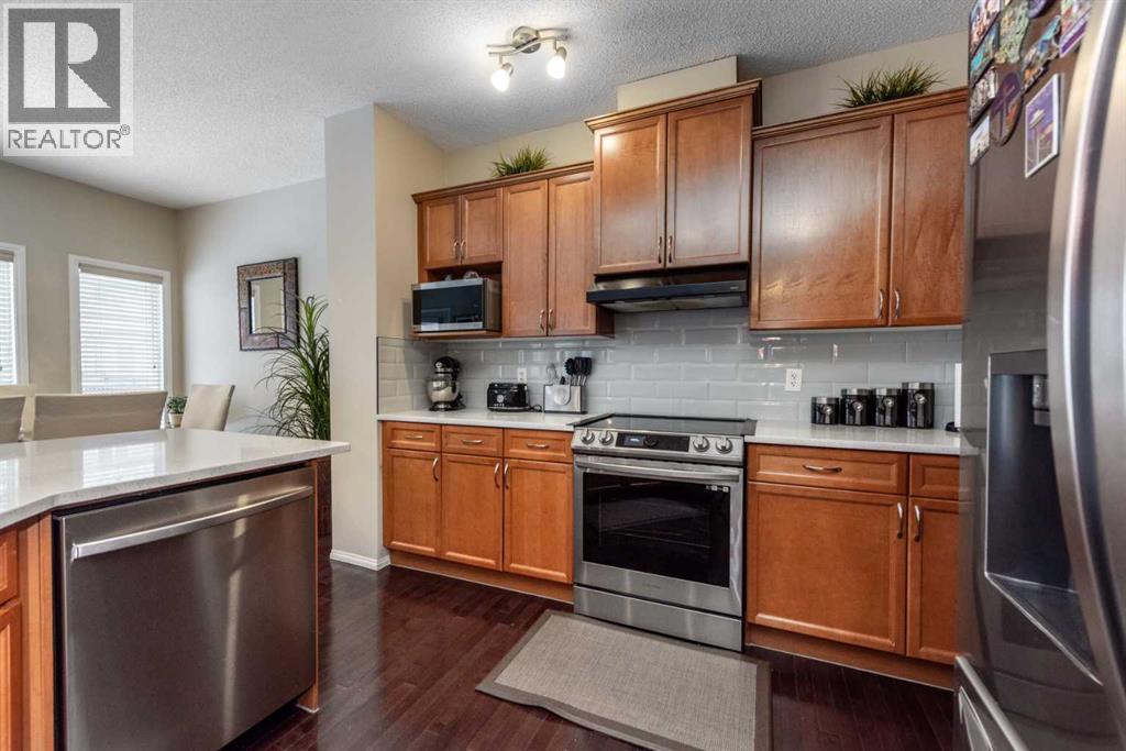 212 Silverado Range Heights Sw, Calgary, AB - Indoor Photo Showing Kitchen With Stainless Steel Kitchen