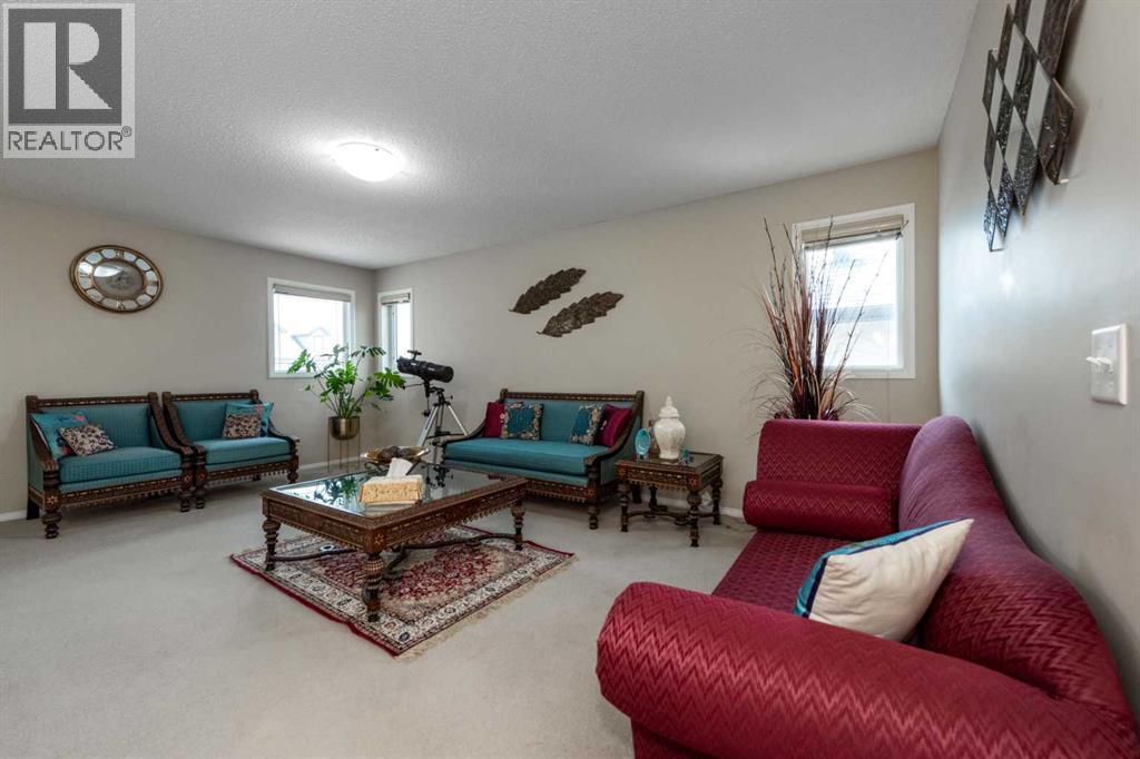 212 Silverado Range Heights Sw, Calgary, AB - Indoor Photo Showing Living Room