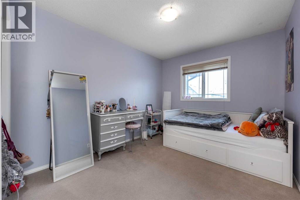 212 Silverado Range Heights Sw, Calgary, AB - Indoor Photo Showing Bedroom