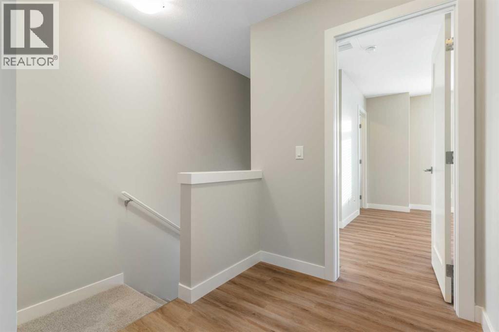 Upper level hall - 217 Sage Bluff Drive Nw, Calgary, AB - Indoor Photo Showing Other Room