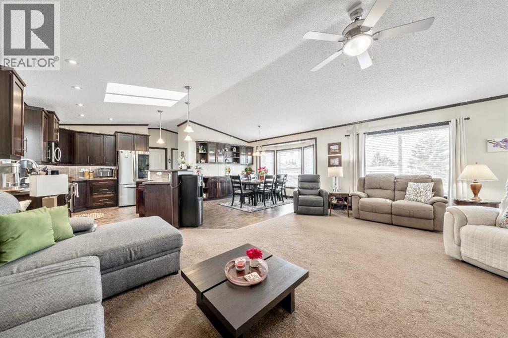 Spacious Open Concept Design - 4 Spring Dale Circle Se, Airdrie, AB - Indoor Photo Showing Living Room