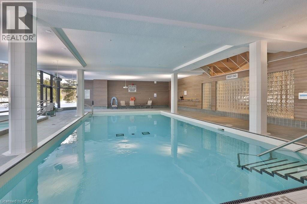 1800 The Collegeway Unit# 211, Mississauga, ON - Indoor Photo Showing Other Room With In Ground Pool