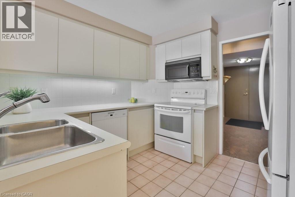 1800 The Collegeway Unit# 211, Mississauga, ON - Indoor Photo Showing Kitchen With Double Sink