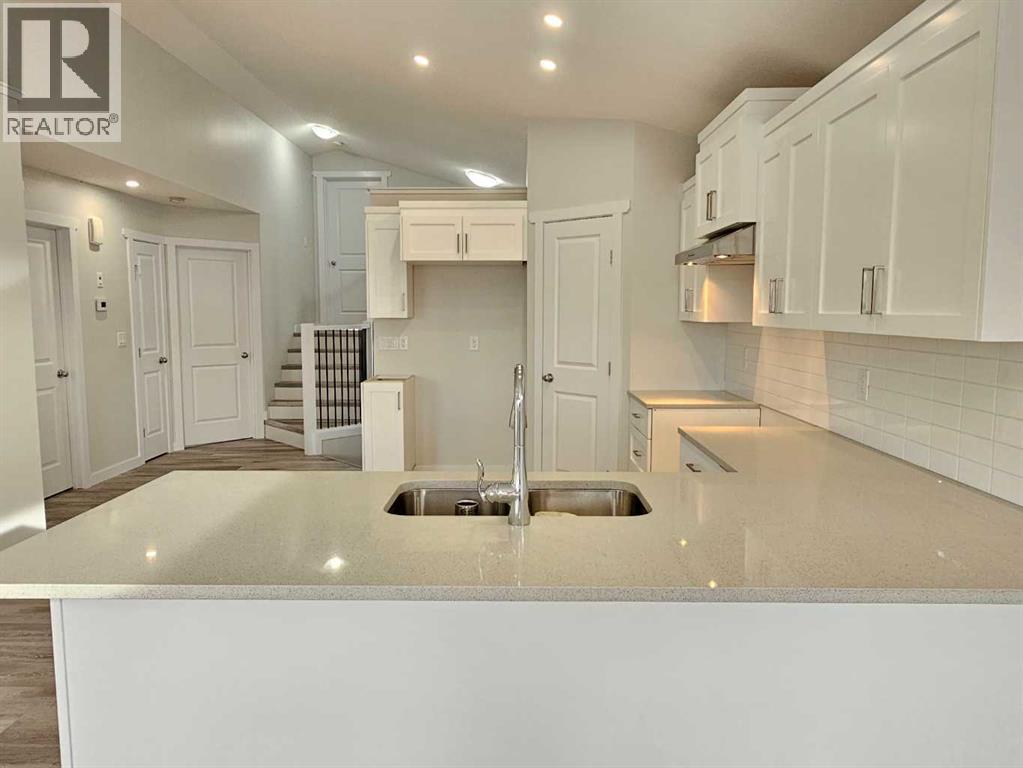 SAMPLE - 9211 94A Avenue, Wembley, AB - Indoor Photo Showing Kitchen With Double Sink