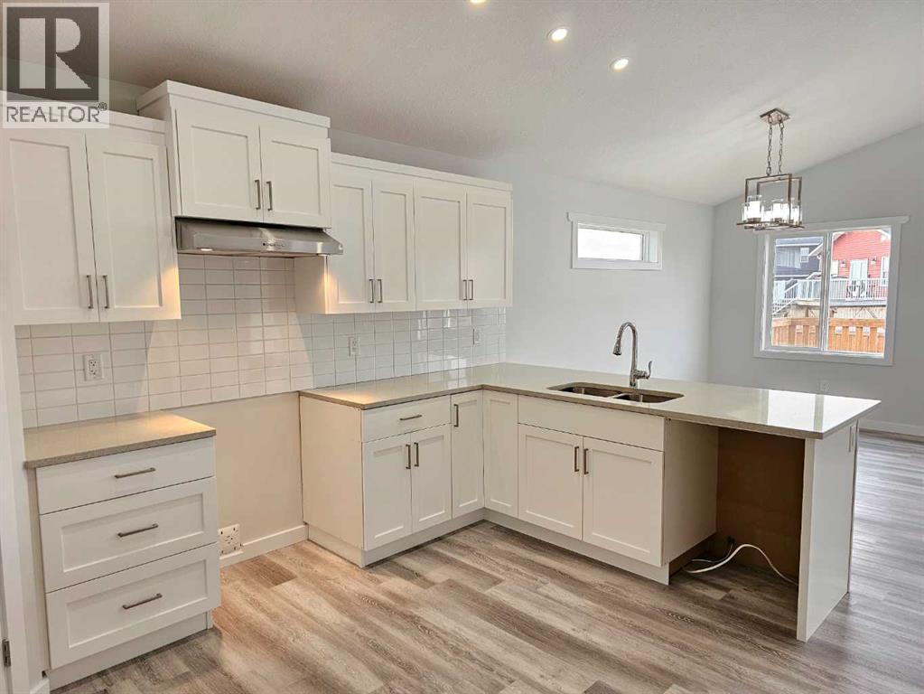 SAMPLE - 9211 94A Avenue, Wembley, AB - Indoor Photo Showing Kitchen With Double Sink