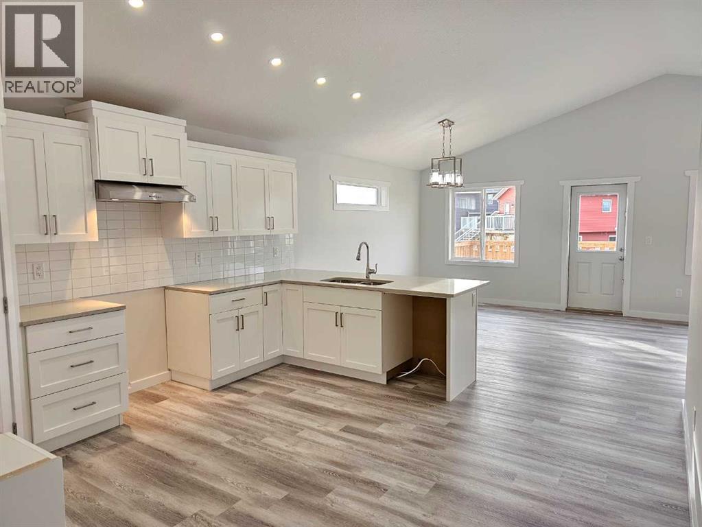 SAMPLE - 9211 94A Avenue, Wembley, AB - Indoor Photo Showing Kitchen With Double Sink