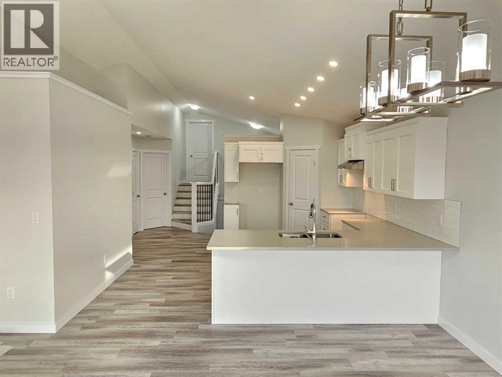 SAMPLE - 9211 94A Avenue, Wembley, AB - Indoor Photo Showing Kitchen With Double Sink