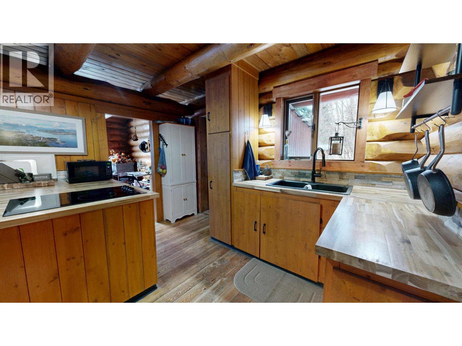 7671 Rutherford Road, Bridge Lake, BC - Indoor Photo Showing Kitchen With Double Sink