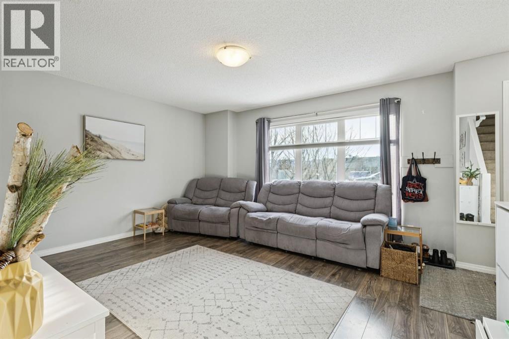 996 Windsong Drive Sw, Airdrie, AB - Indoor Photo Showing Living Room