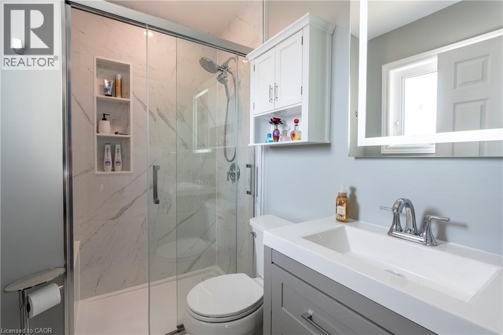 Bathroom with vanity and a marble finish shower - 29 Armstrong Crescent, Grey Highlands, ON - Indoor Photo Showing Bathroom