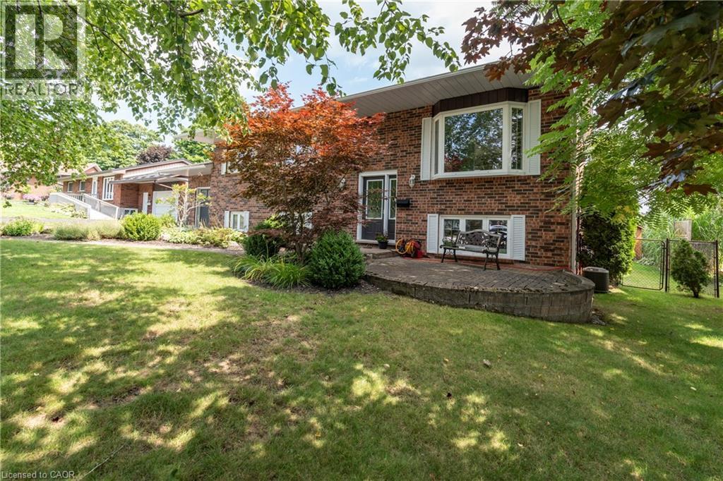 Back of property with brick siding and a gate - 29 Armstrong Crescent, Grey Highlands, ON - Outdoor